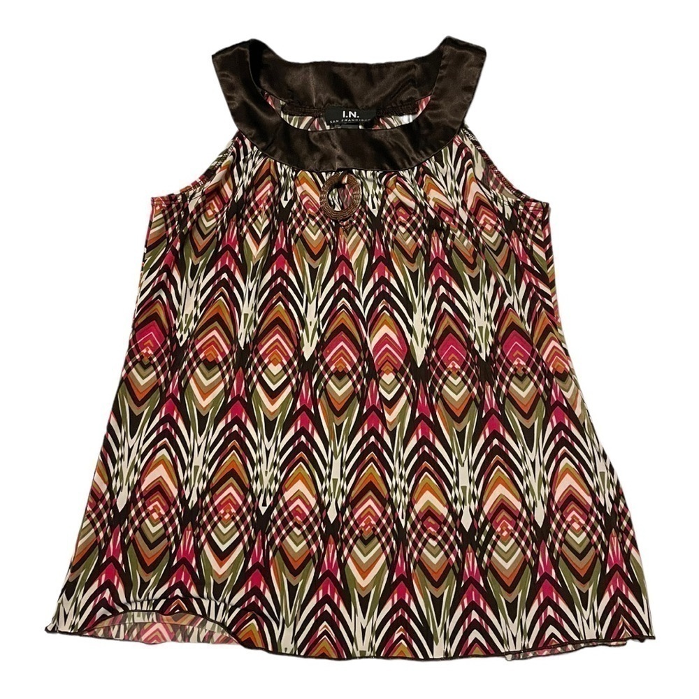 BOHO style shell with detailed neckline.